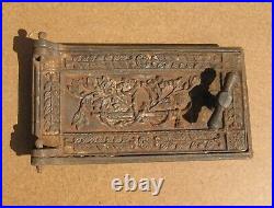 Antique cast iron door with frame for wood burning stove