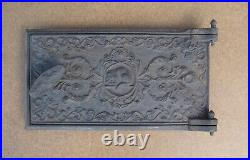 Antique cast iron door with frame for wood burning stove Antique cast iron door with frame for wood burning stove