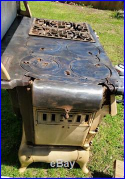 Antique gas/wood burning cook stove